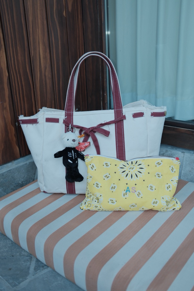 BYGP bag on a striped cushion